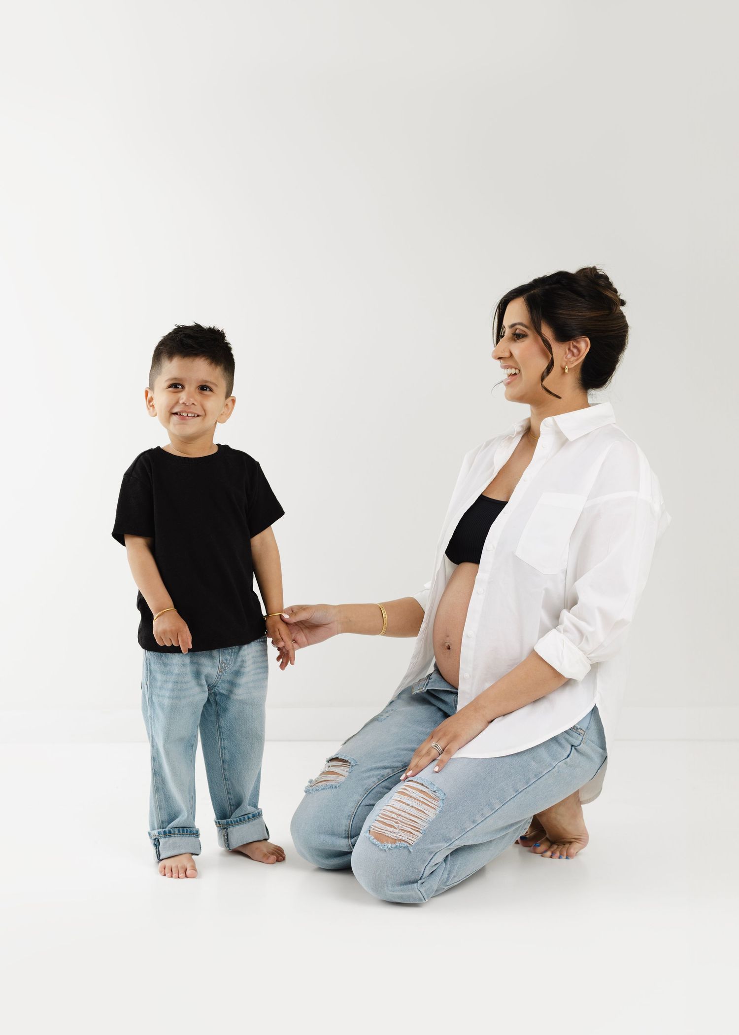 Gorgeous Rumneet awaits her new baby's arrival. Cloverdale. Surrey. Maternity Photography bump photos. Sleek black dress with cutout.