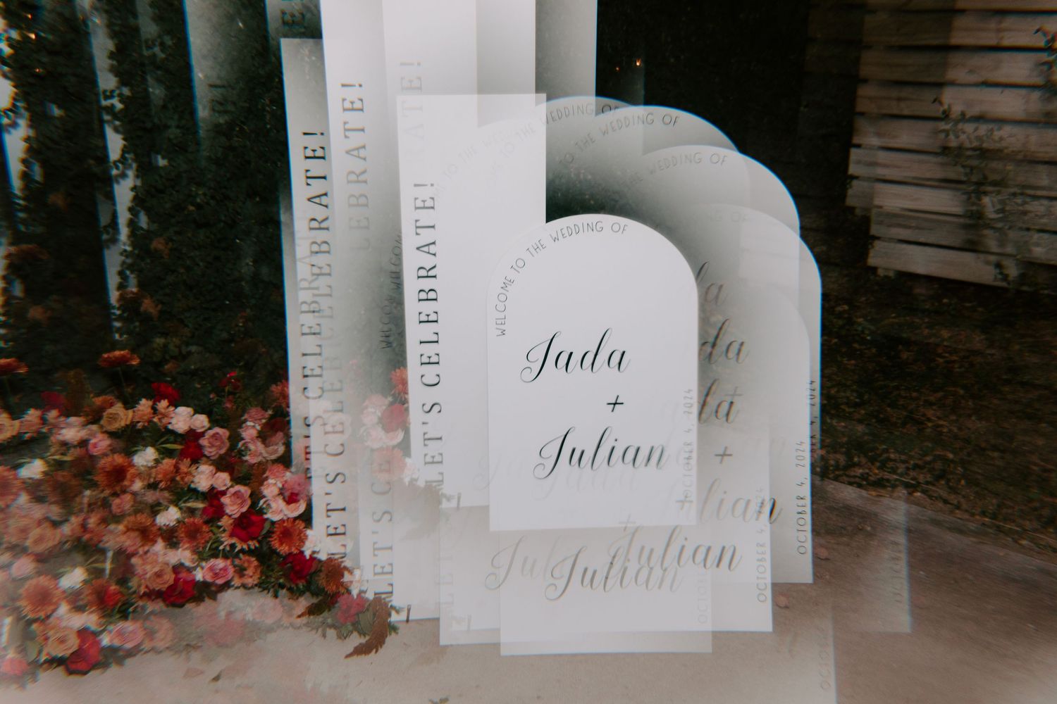 Wedding signage with elegant script text shown on white cards.