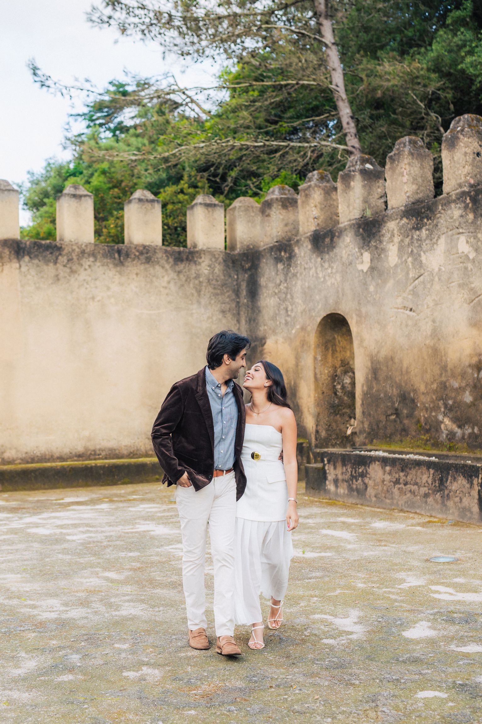 Romantic engagement photo-shoot in Sintra, Portugal, with an Indian couple exploring Penha Longa. By a destination wedding Photographer