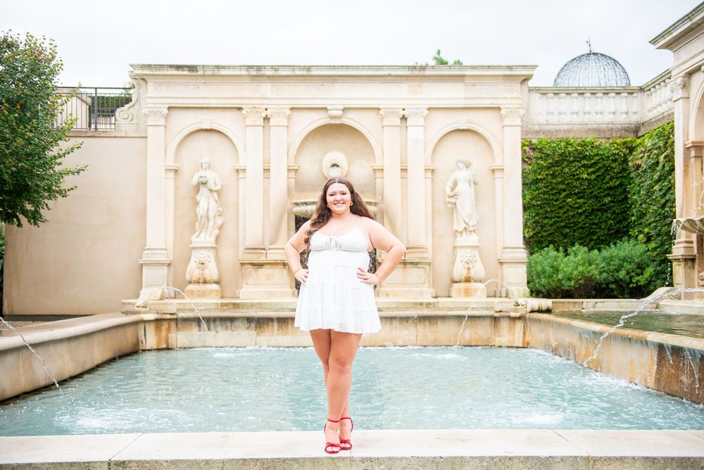 Column arches and fountains decorate a stately courtyard at an elegant European-style manor.