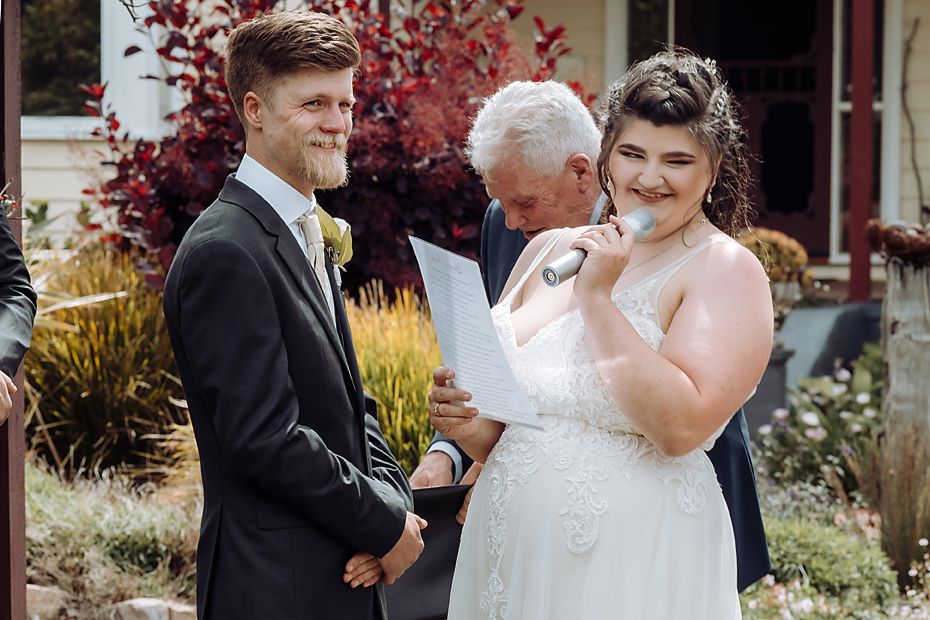 Wedding party celebrating and having fun during outdoor formal photos.
