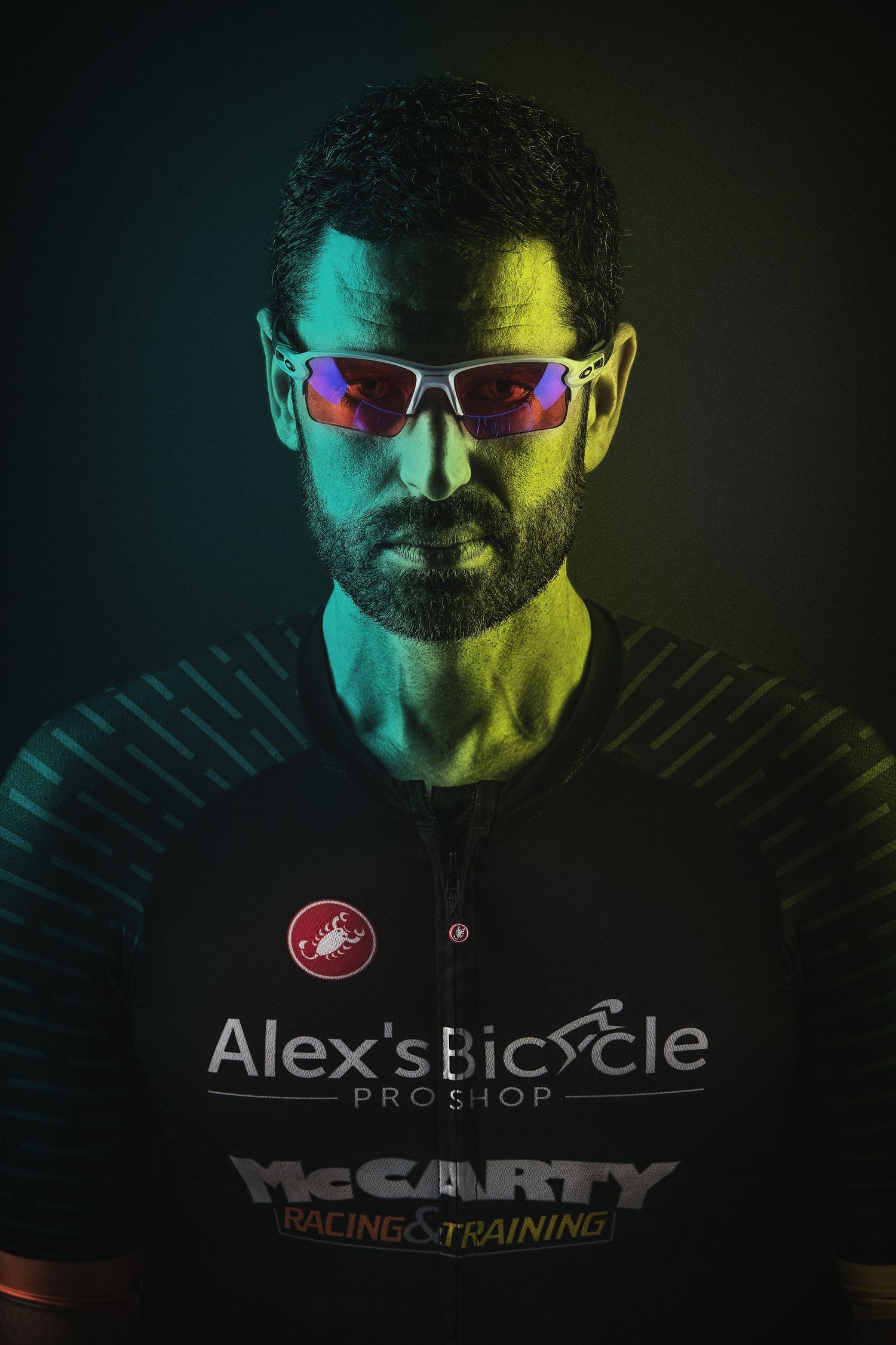 A series of moody portraits showing cycling gear and sunglasses with colorful lighting effects.