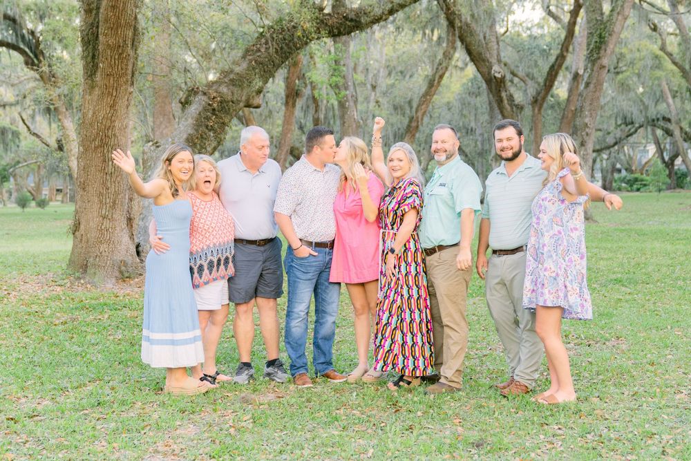 The moment she said yes—Mallery Park proposal on St. Simons Island full of emotion and golden light with all their family together!!