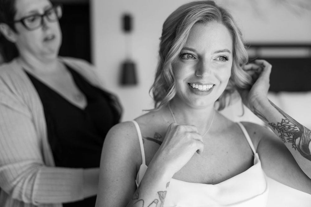 Candid photo of bride getting ready at Breckenridge wedding