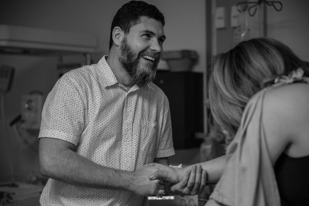 lighthearted moment between couple during labor birth photographer cape town