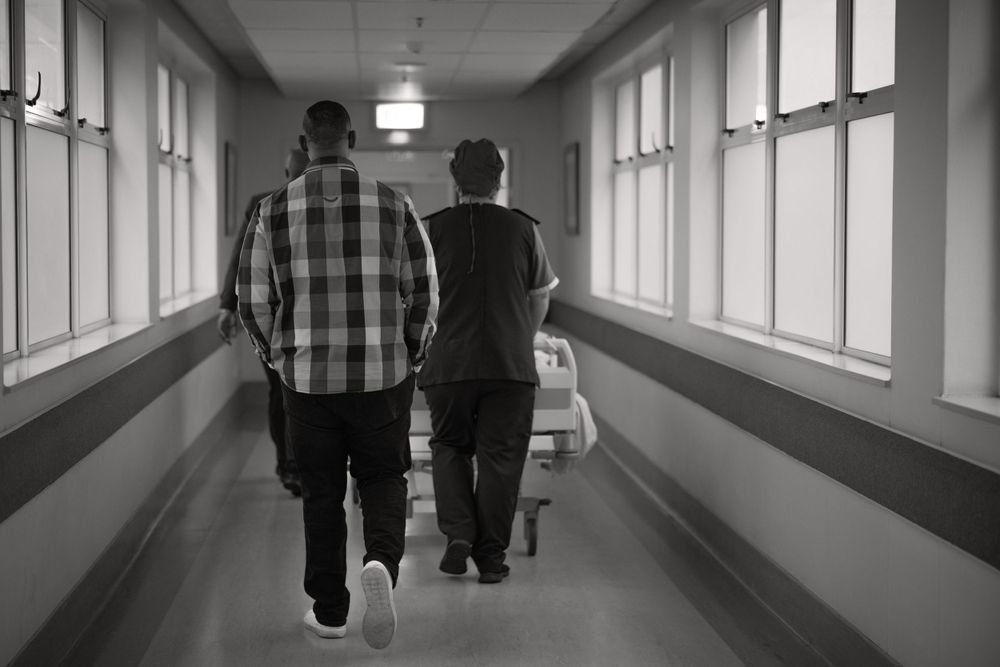 Dad following mom to theatre C-section delivery Birth Photographer Cape town
