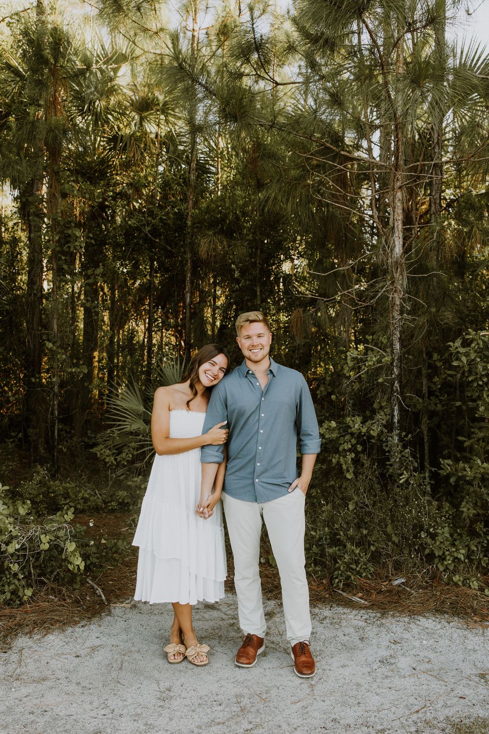 Golden hour Engagement photos captured by Lindsay McDow Photography in the greenery of a nature trail in West Palm Beach, Florida