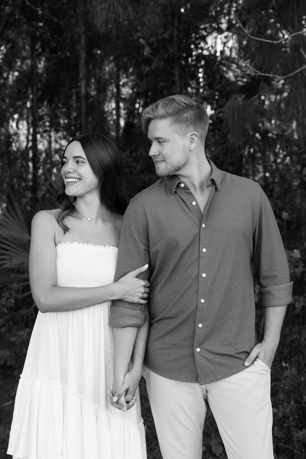 Golden hour Engagement photos captured by Lindsay McDow Photography in the greenery of a nature trail in West Palm Beach, Florida