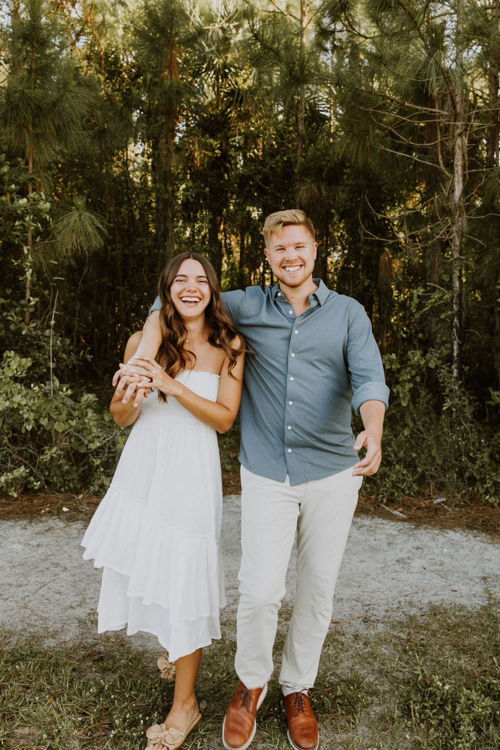 Golden hour Engagement photos captured by Lindsay McDow Photography in the greenery of a nature trail in West Palm Beach, Florida