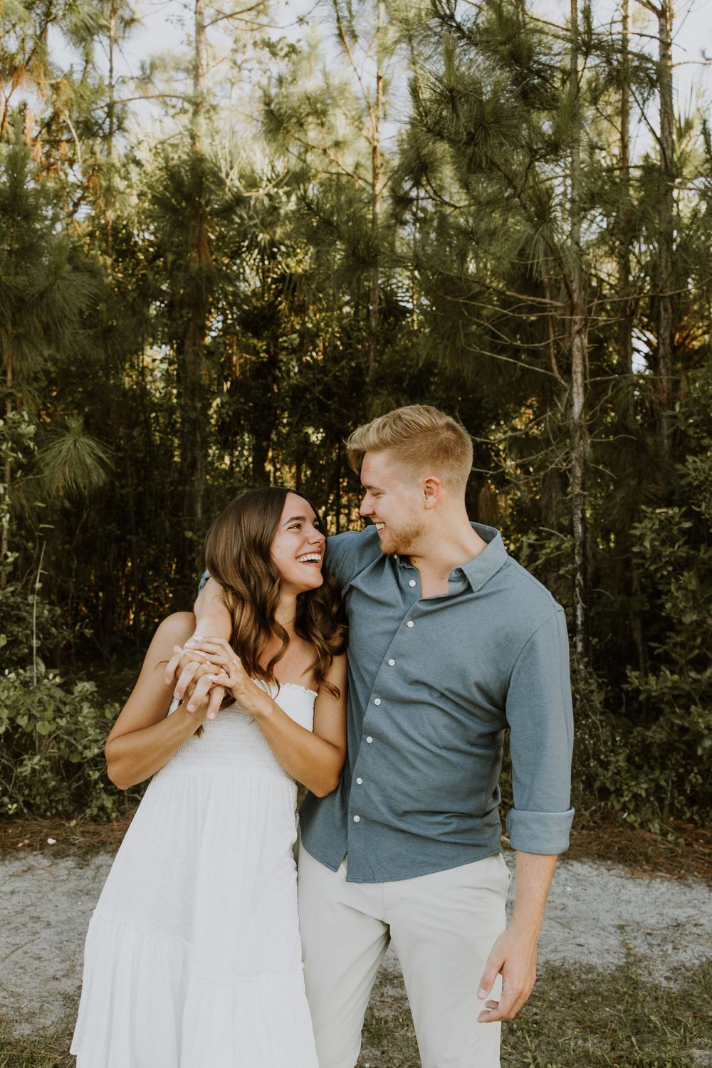 Golden hour Engagement photos captured by Lindsay McDow Photography in the greenery of a nature trail in West Palm Beach, Florida