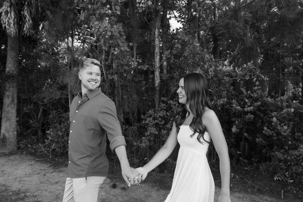 Golden hour Engagement photos captured by Lindsay McDow Photography in the greenery of a nature trail in West Palm Beach, Florida