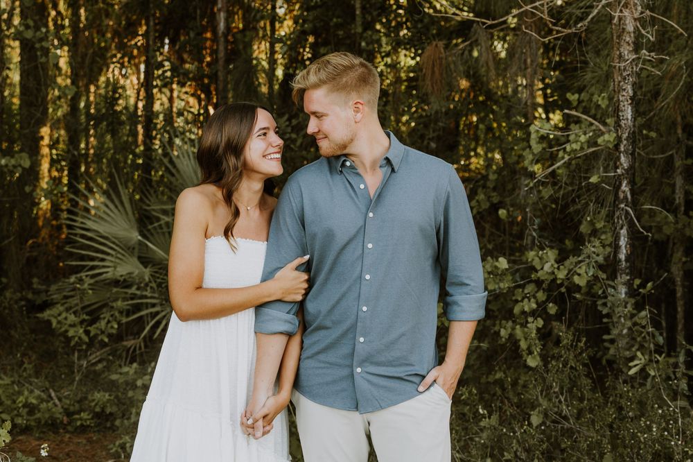 Golden hour Engagement photos captured by Lindsay McDow Photography in the greenery of a nature trail in West Palm Beach, Florida