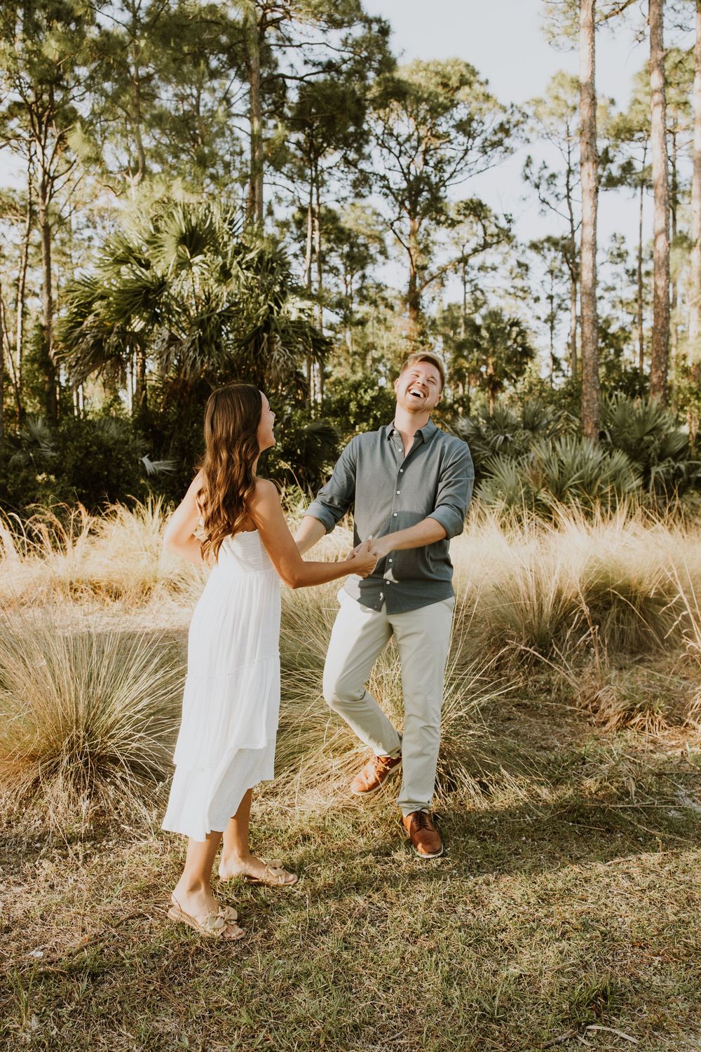 Golden hour Engagement photos captured by Lindsay McDow Photography in the greenery of a nature trail in West Palm Beach, Florida