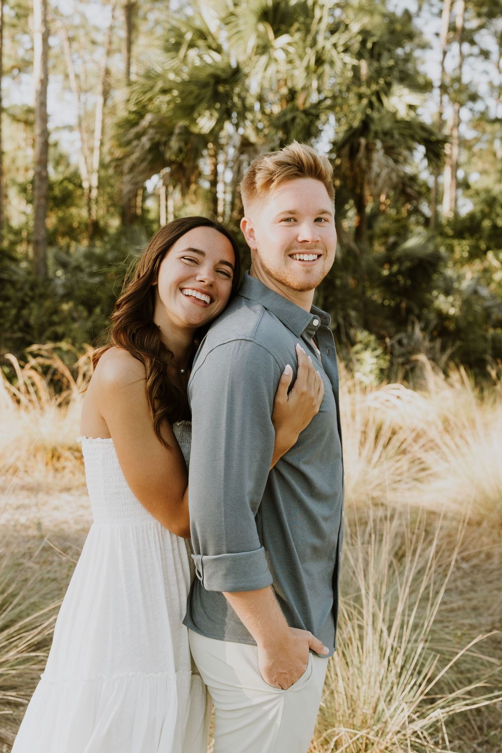 Golden hour Engagement photos captured by Lindsay McDow Photography in the greenery of a nature trail in West Palm Beach, Florida