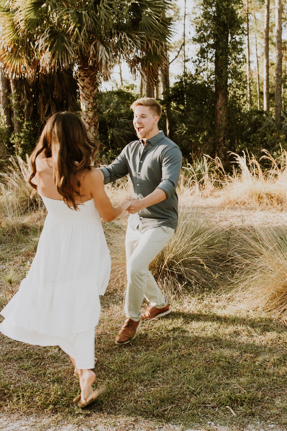 Golden hour Engagement photos captured by Lindsay McDow Photography in the greenery of a nature trail in West Palm Beach, Florida