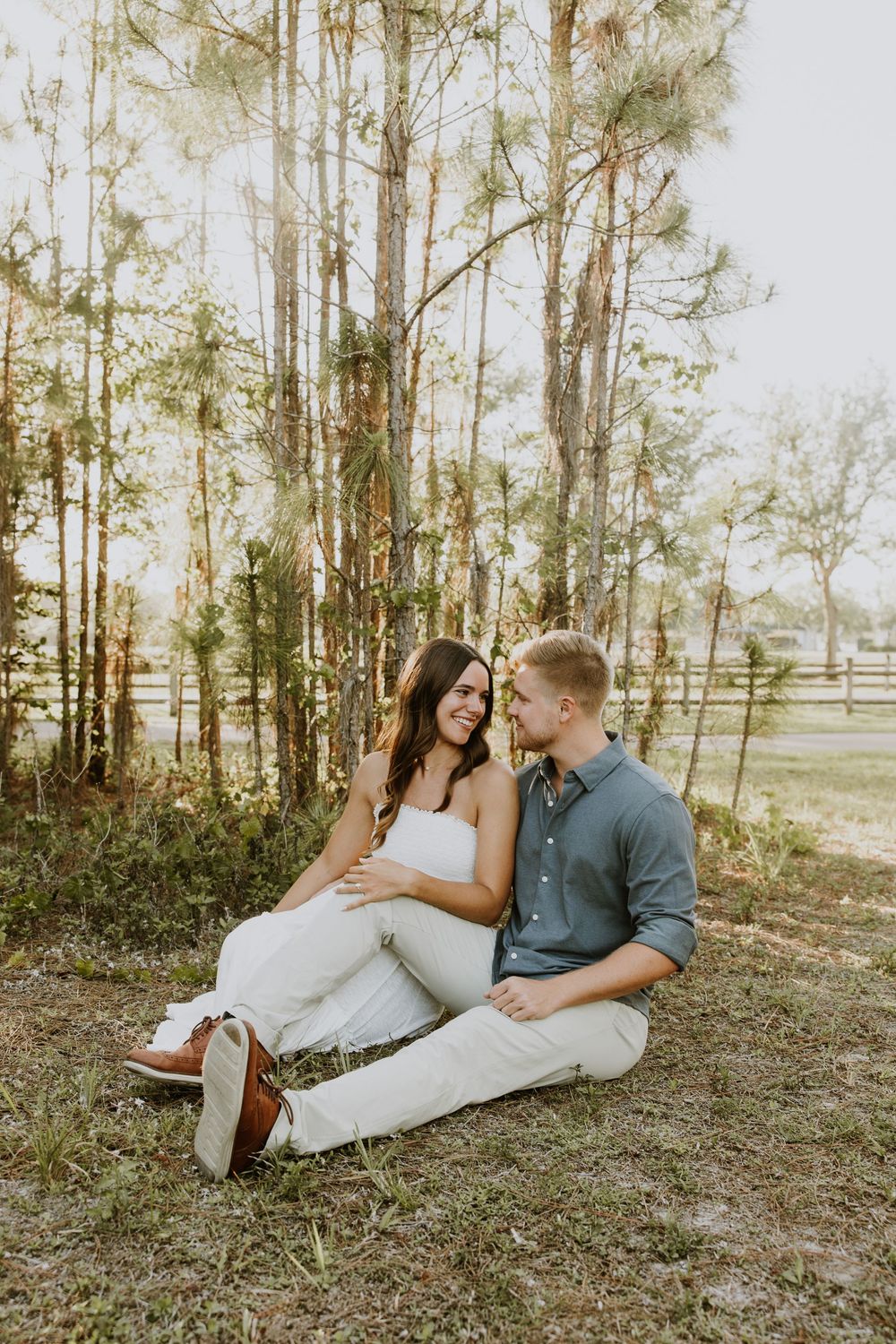 Golden hour Engagement photos captured by Lindsay McDow Photography in the greenery of a nature trail in West Palm Beach, Florida