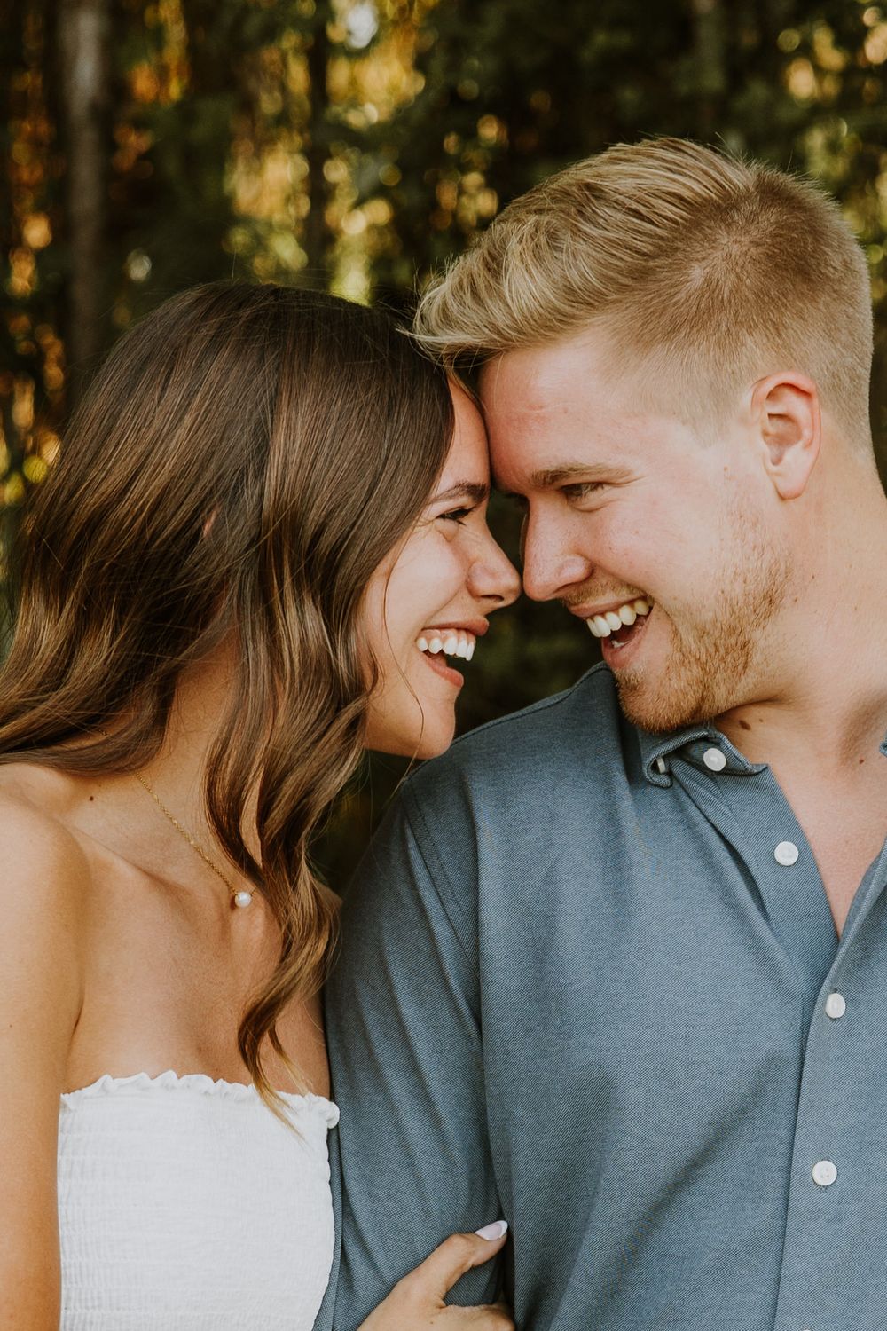 Golden hour Engagement photos captured by Lindsay McDow Photography in the greenery of a nature trail in West Palm Beach, Florida