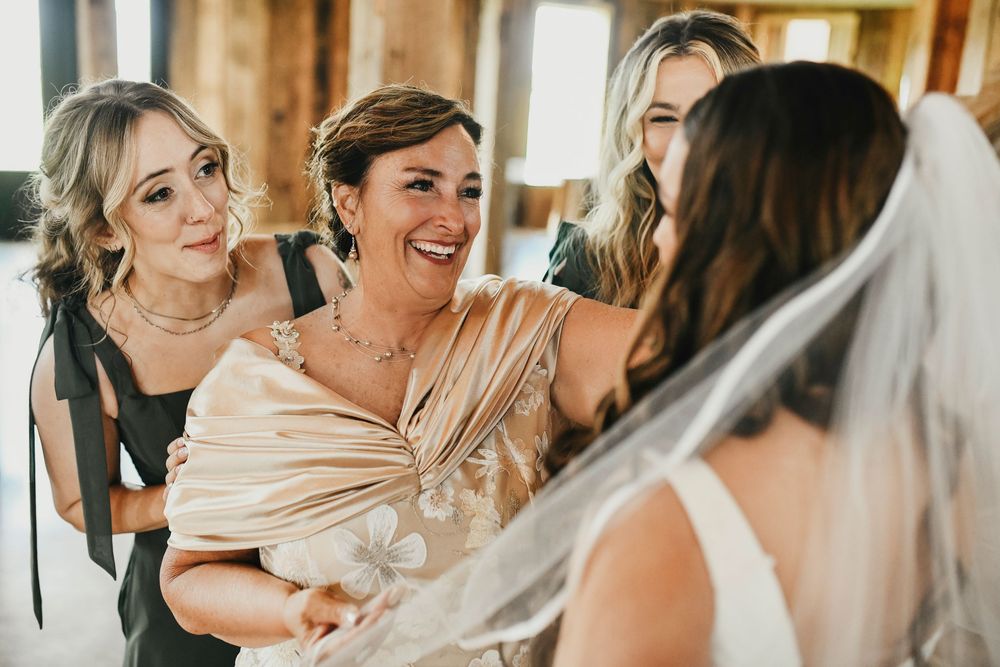 Bridal party in mix-and-match green dresses at North Texas venue