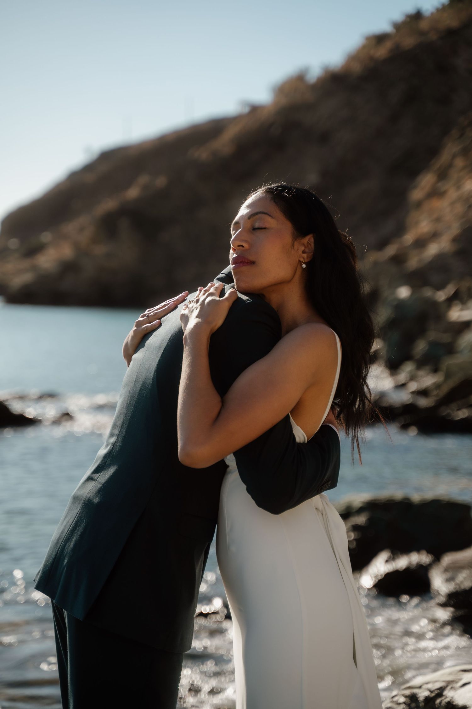 An intimate portrait of a bride and groom hugging after their wedding in Paros Greece