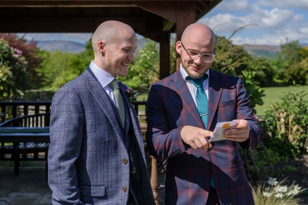 Groom with his best man by gazebo before outdoor wedding at Cragwood Hotel