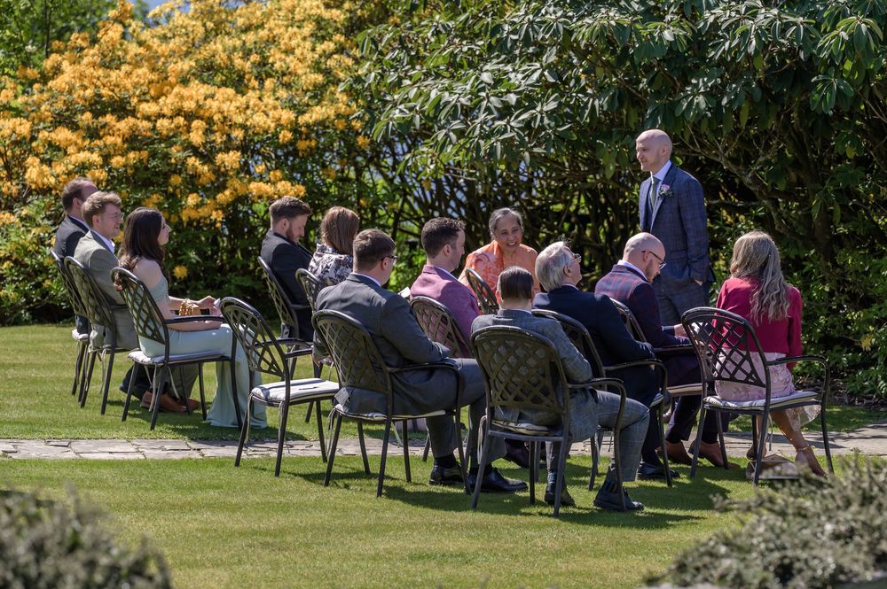 Wedding guests seated outside by gazebo at Cragwood Country House Hotel