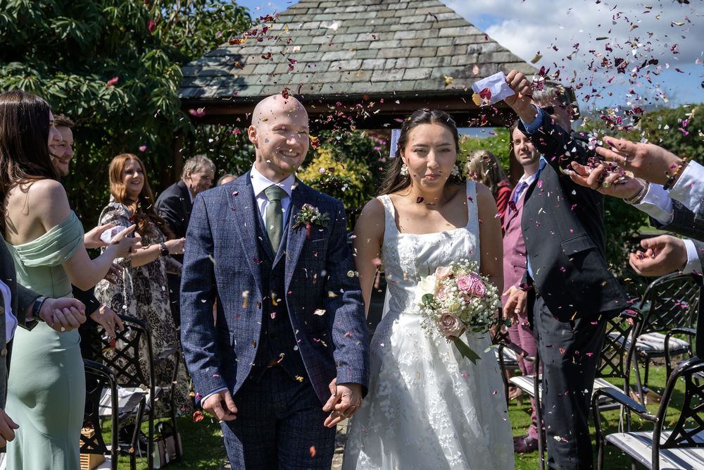 Confetti exit after outdoor wedding at Cragwood Country House