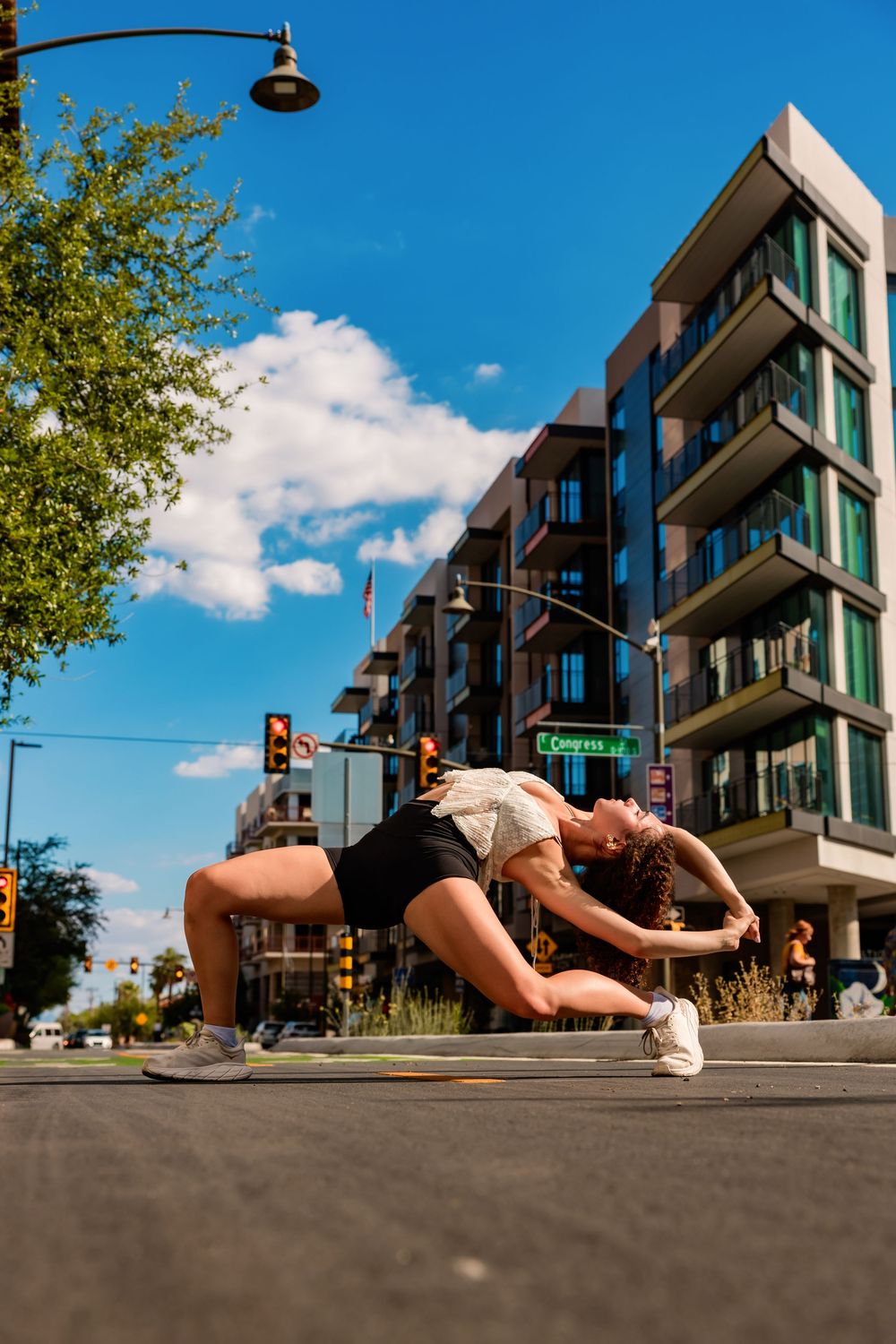 Dance portrait of Evelyn with downtown Tucson buildings in the background