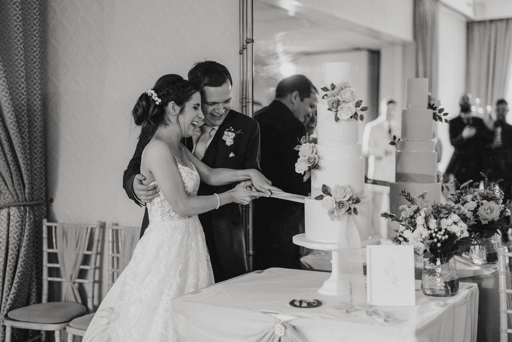 Bride and groom cut their wedding cake together at Cave Castle - taken by Grimsby photographer.