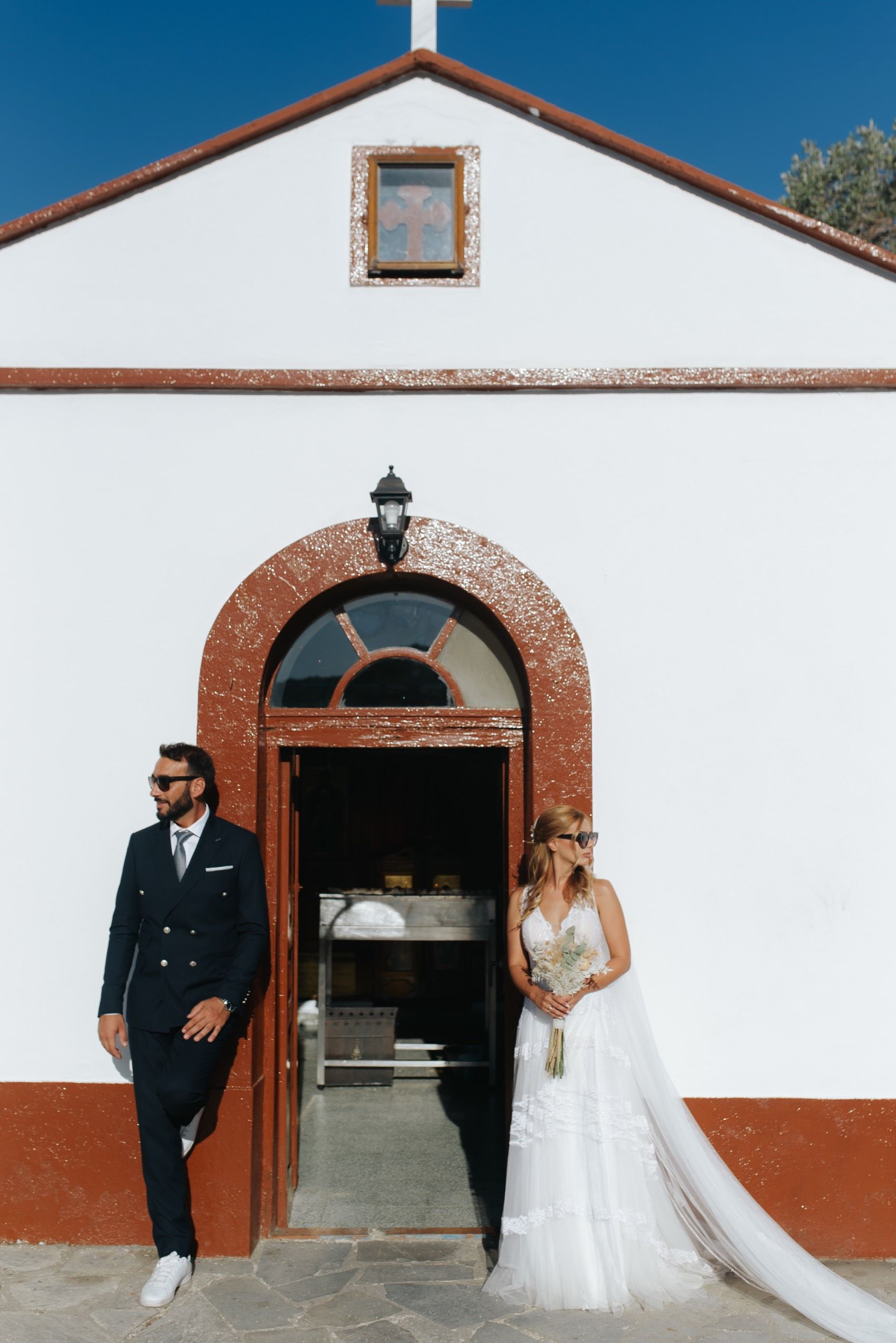 A series of four wedding photos showing an architectural entrance with red brick archways and white walls.