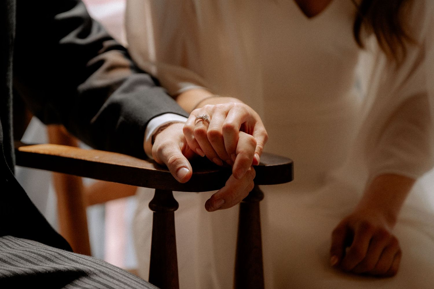 groom and bride holding hands