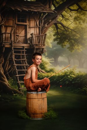 A magical portrait of a child sitting on a wooden barrel near a treehouse in a misty forest setting.