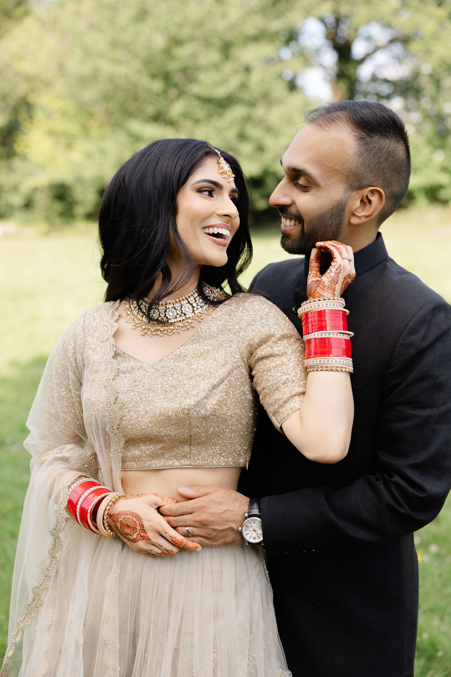 Indian bride and groom walking at the Great Barn in Harrow
