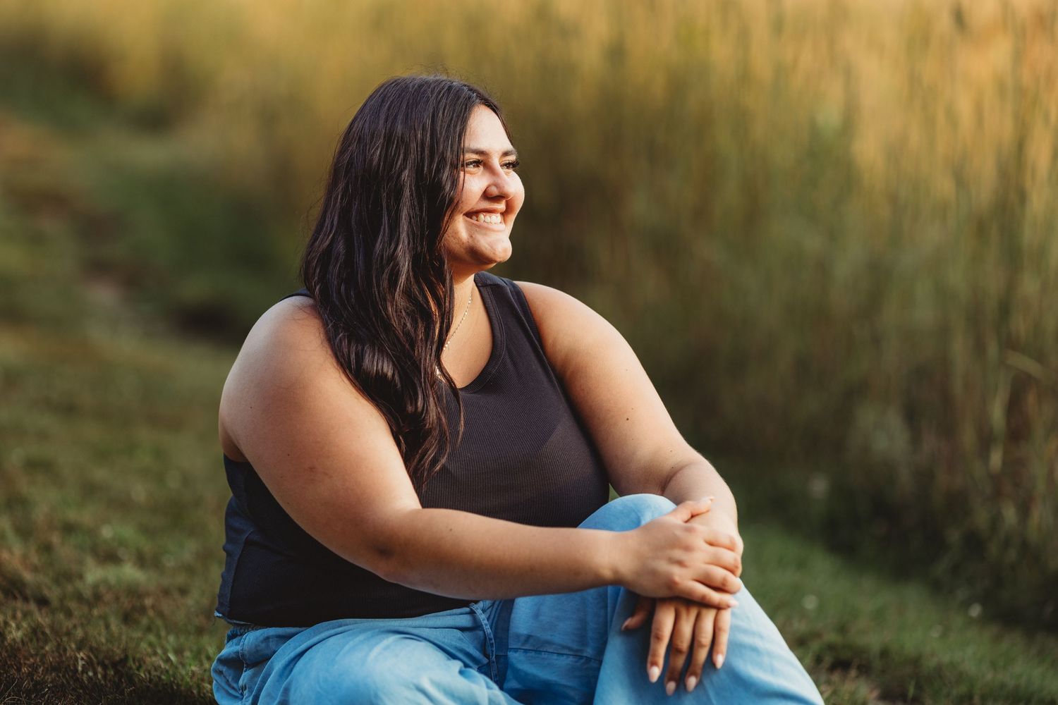 Professional photo of a woman in the grass