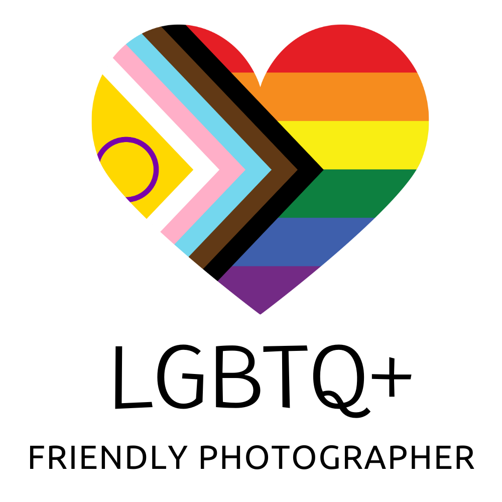 Progress pride heart design featuring rainbow stripes and inclusive chevron pattern.