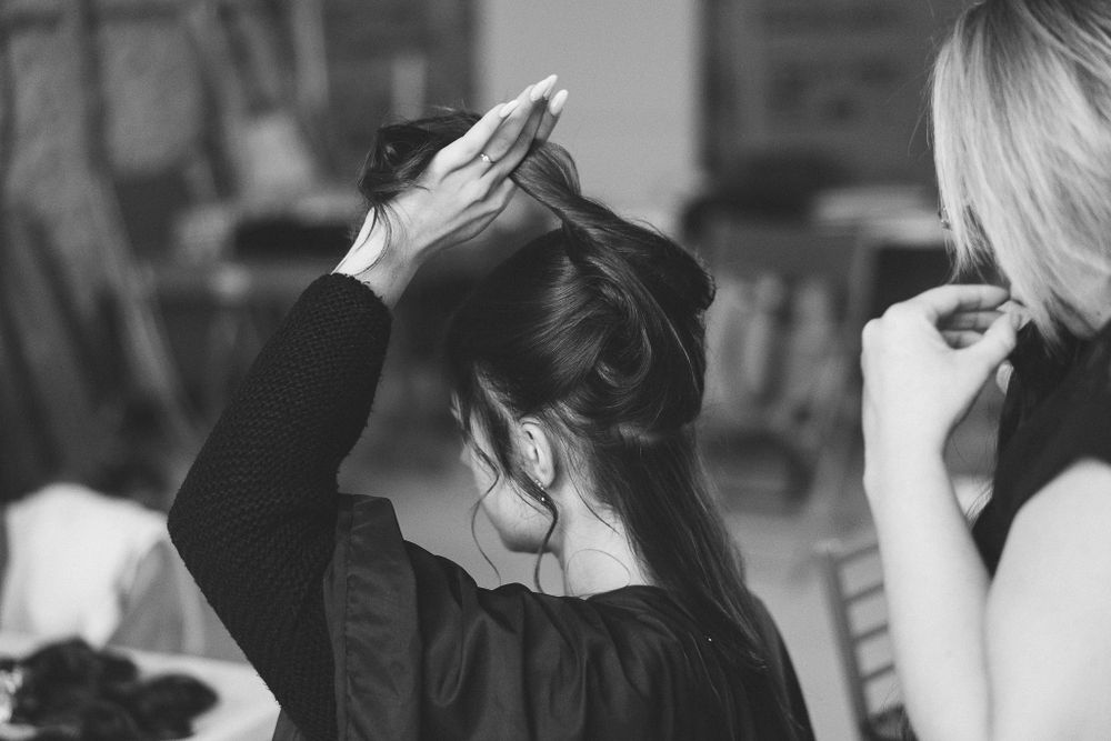 Black and white candid reception photographs capturing emotional moments during an event.