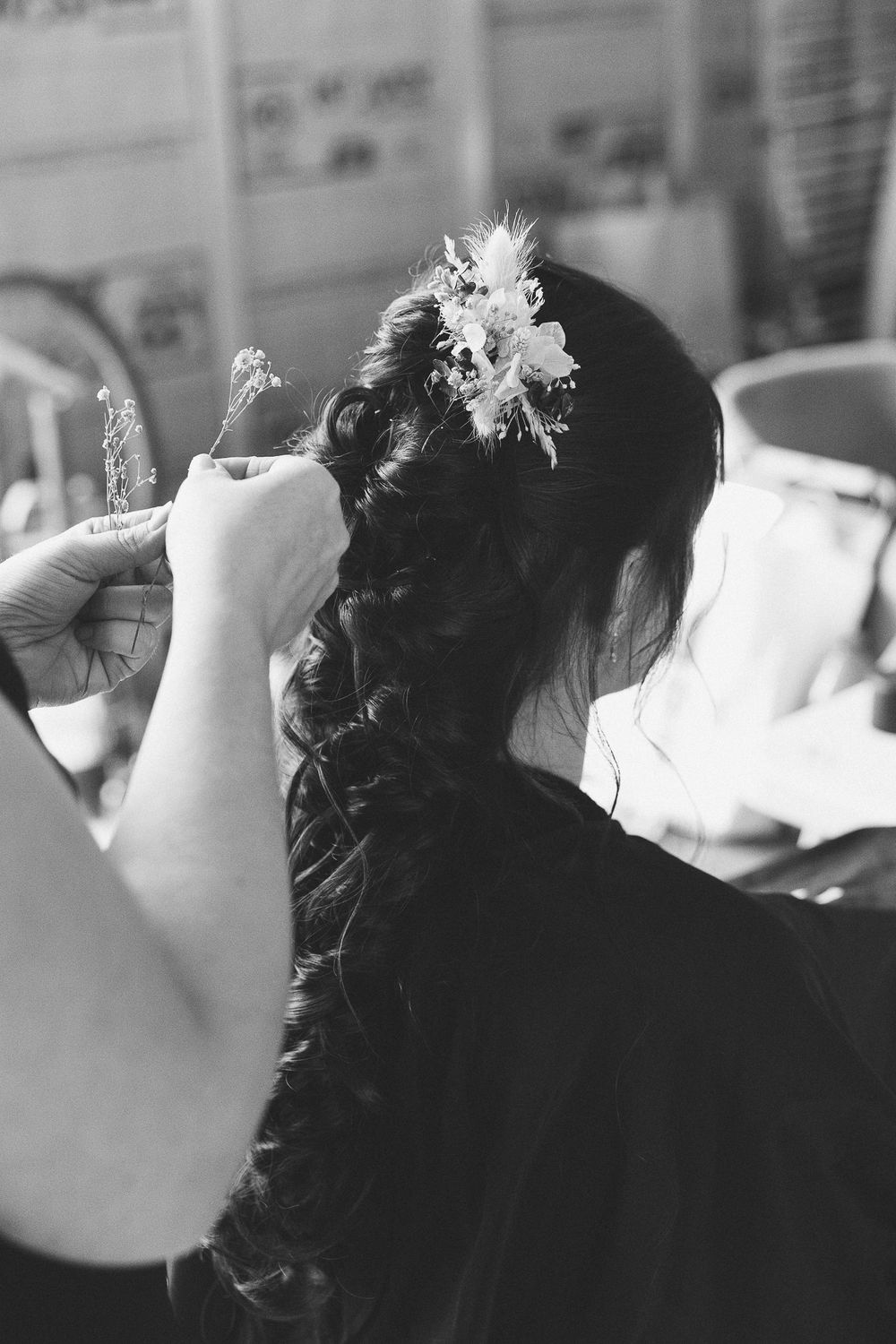 Stylish black and white photography capturing candid getting ready moments.