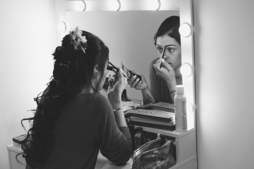Well-lit makeup station with illuminated mirror in professional styling setup.