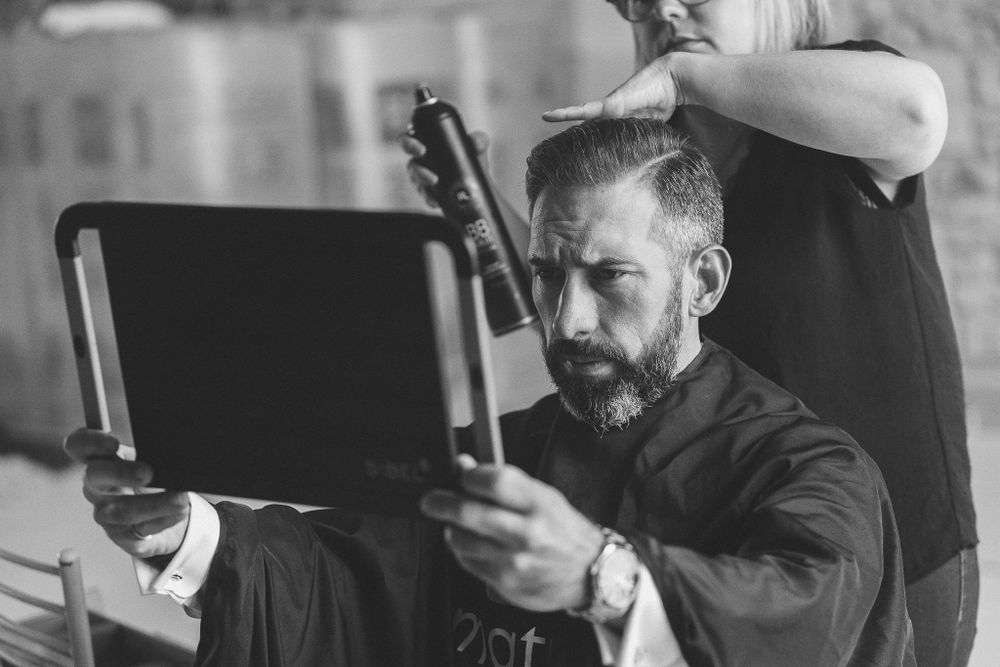 Behind-the-scenes photography session during wedding preparations.
