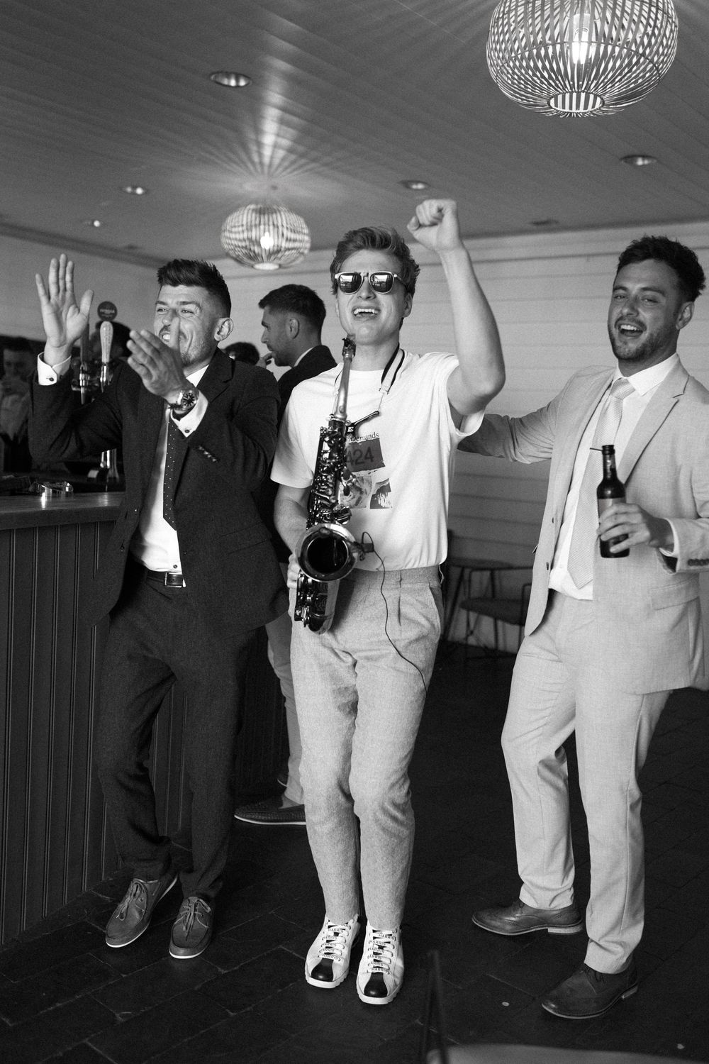 Guests dancing during sunset drinks with Ibiza saxophone music