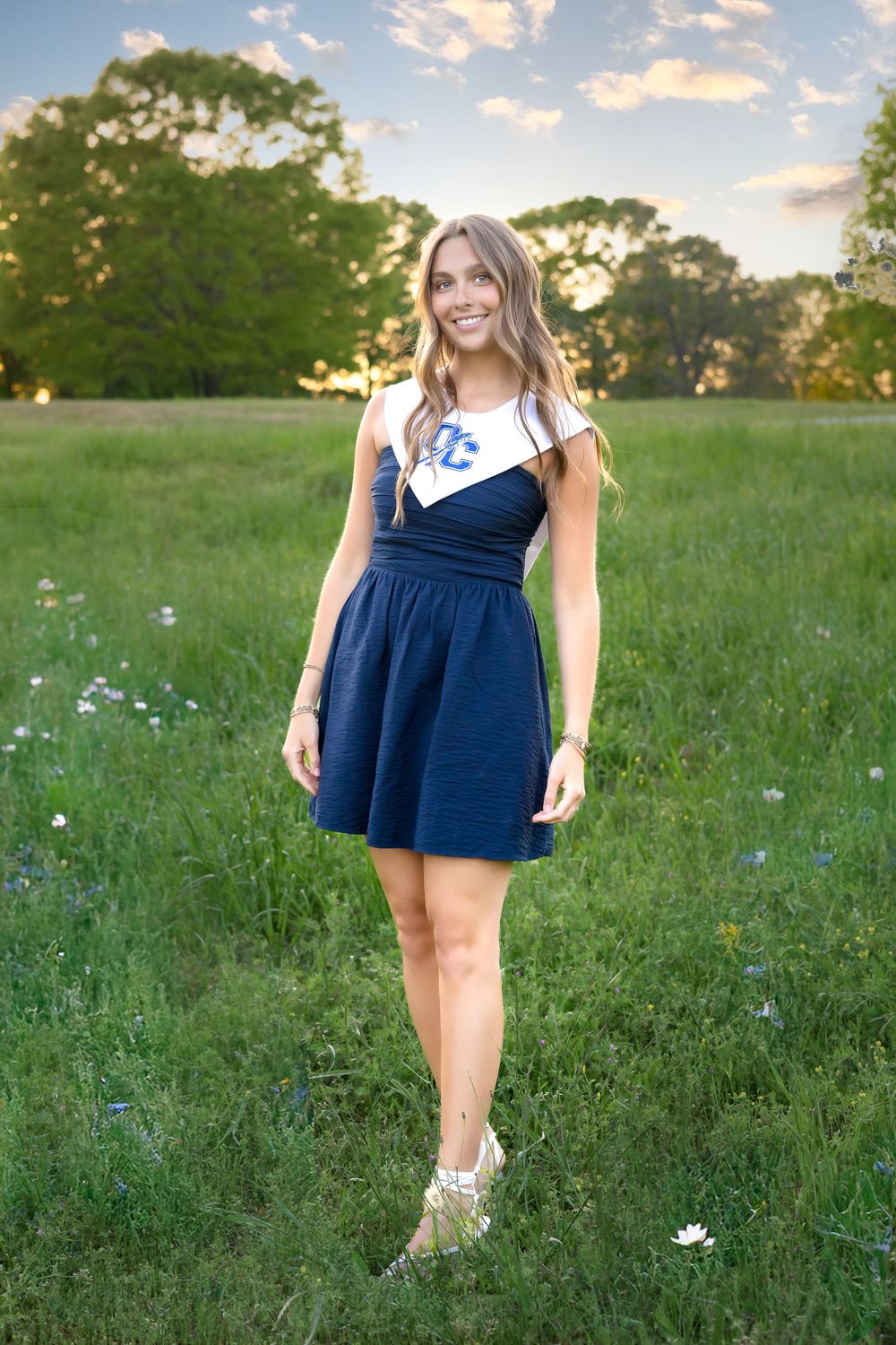 OCHS senior in navy dress holding during graduation photography session at sunset in Athens, GA. - Senior photographer in Athens GA
