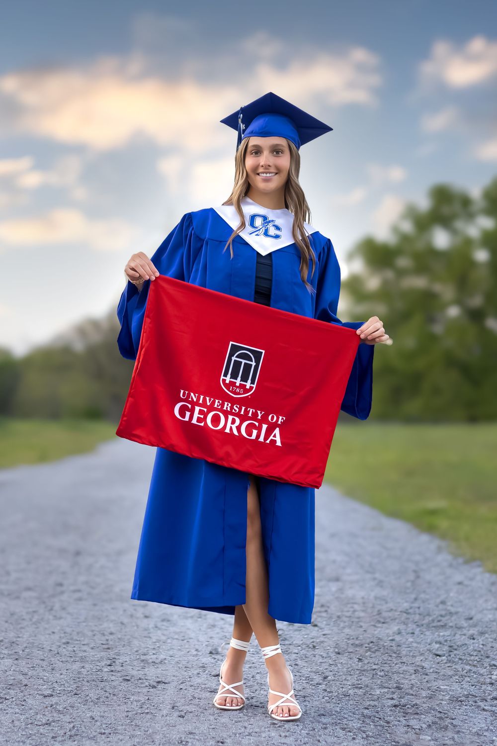 UGA-bound senior smiling during outdoor graduation session in Athens, GA. - Senior photographer in Athens