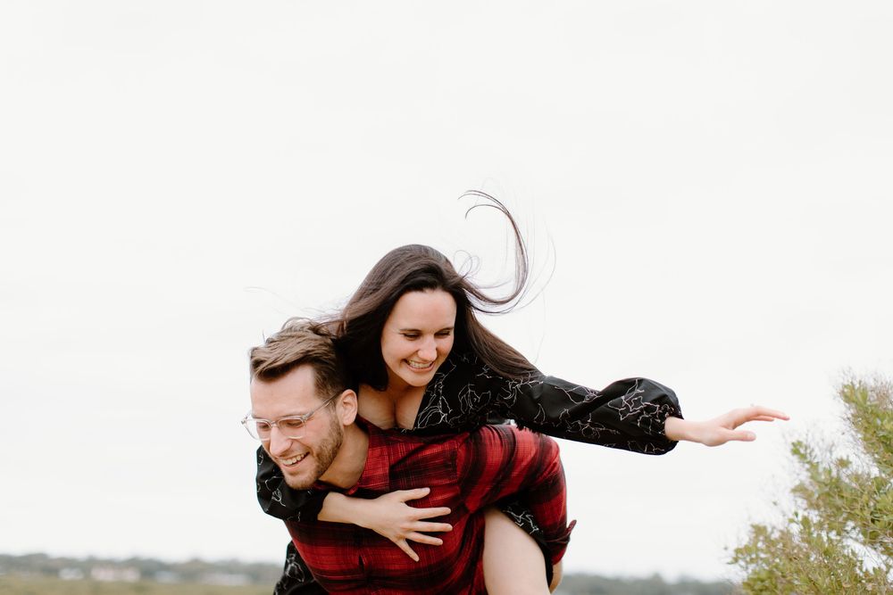 Playful piggyback ride moment captured outdoors.