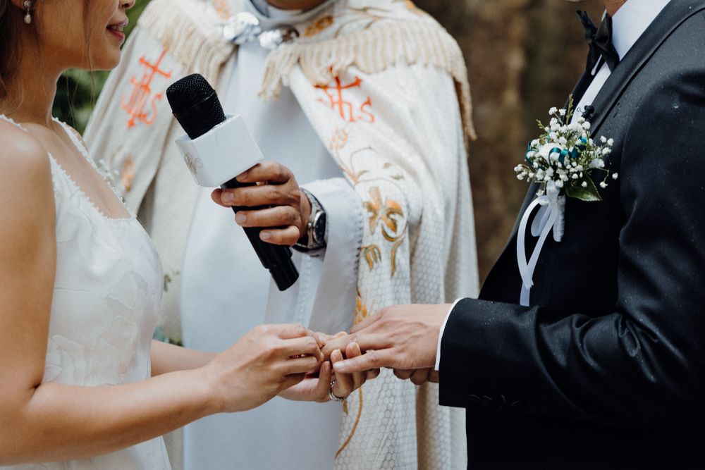 Close-up view of exchanging vows captured by Apertured Media Auckland Wedding Photographer.