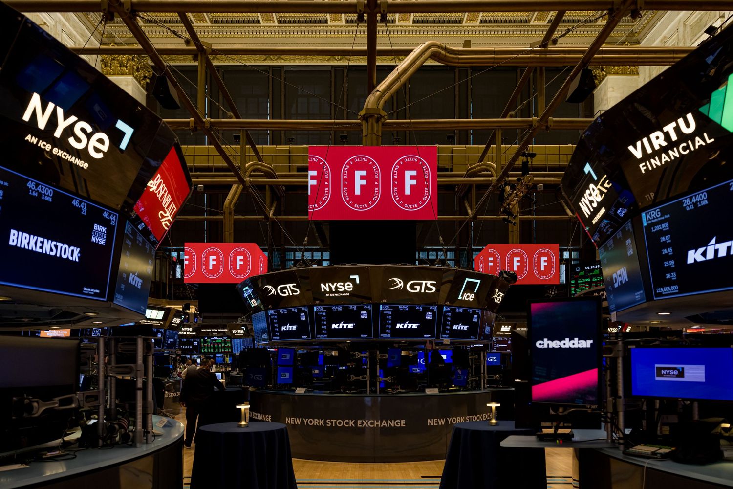 Professional photo of the FSuite event at the NYSE, capturing attendees in a dynamic, corporate setting