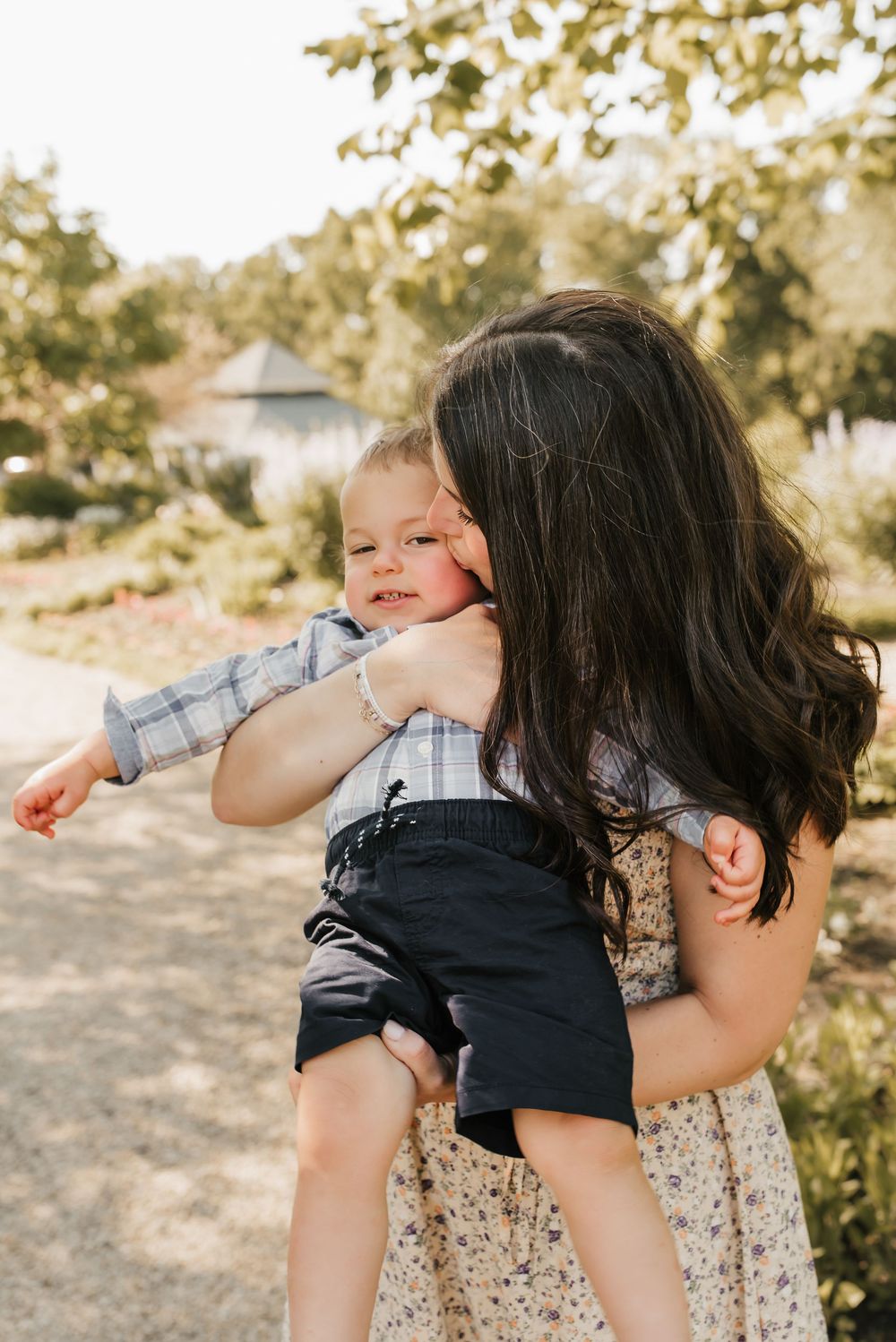 mom kisses baby boy on cheek