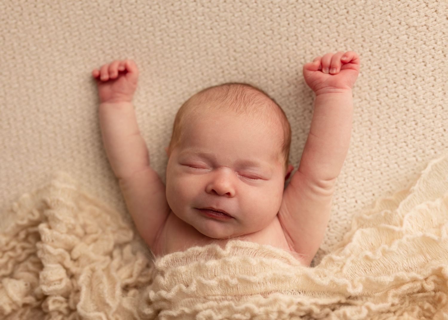 Baby Kathleen stretches during her sleepy newborn photos. Elizabeth Lang Photography session Cloverdale.