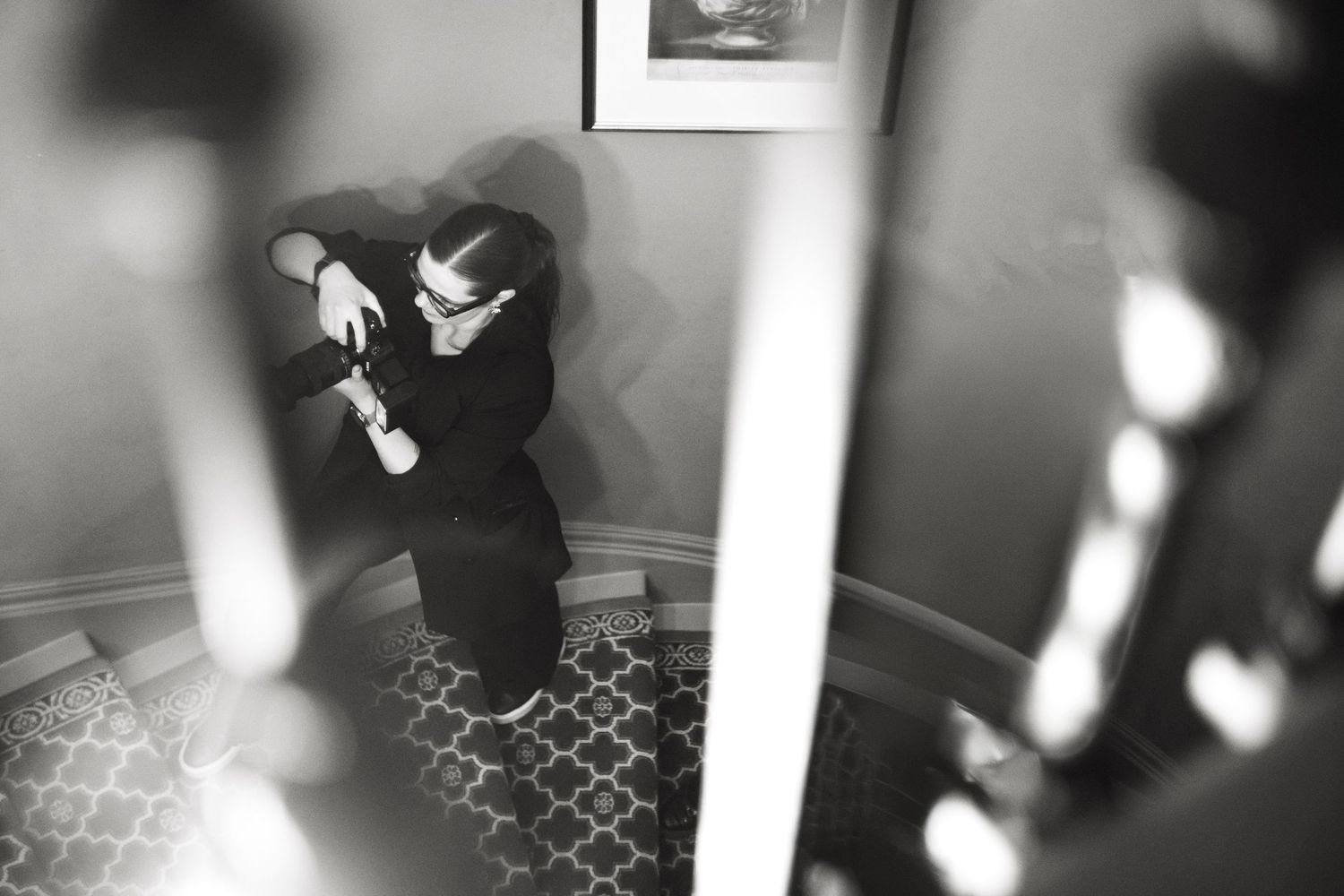 Black and white artistic shots of an interior space with intricate architectural details.