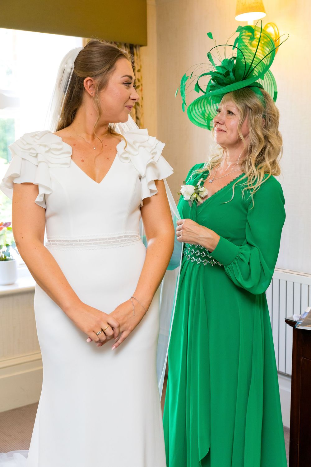 Louisa sharing a touching moment with her mum during bridal prep at Audley’s Wood Hotel.