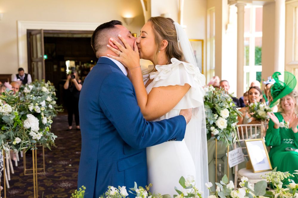 Louisa and Alan share their first kiss as a married couple at Audley’s Wood Hotel.
