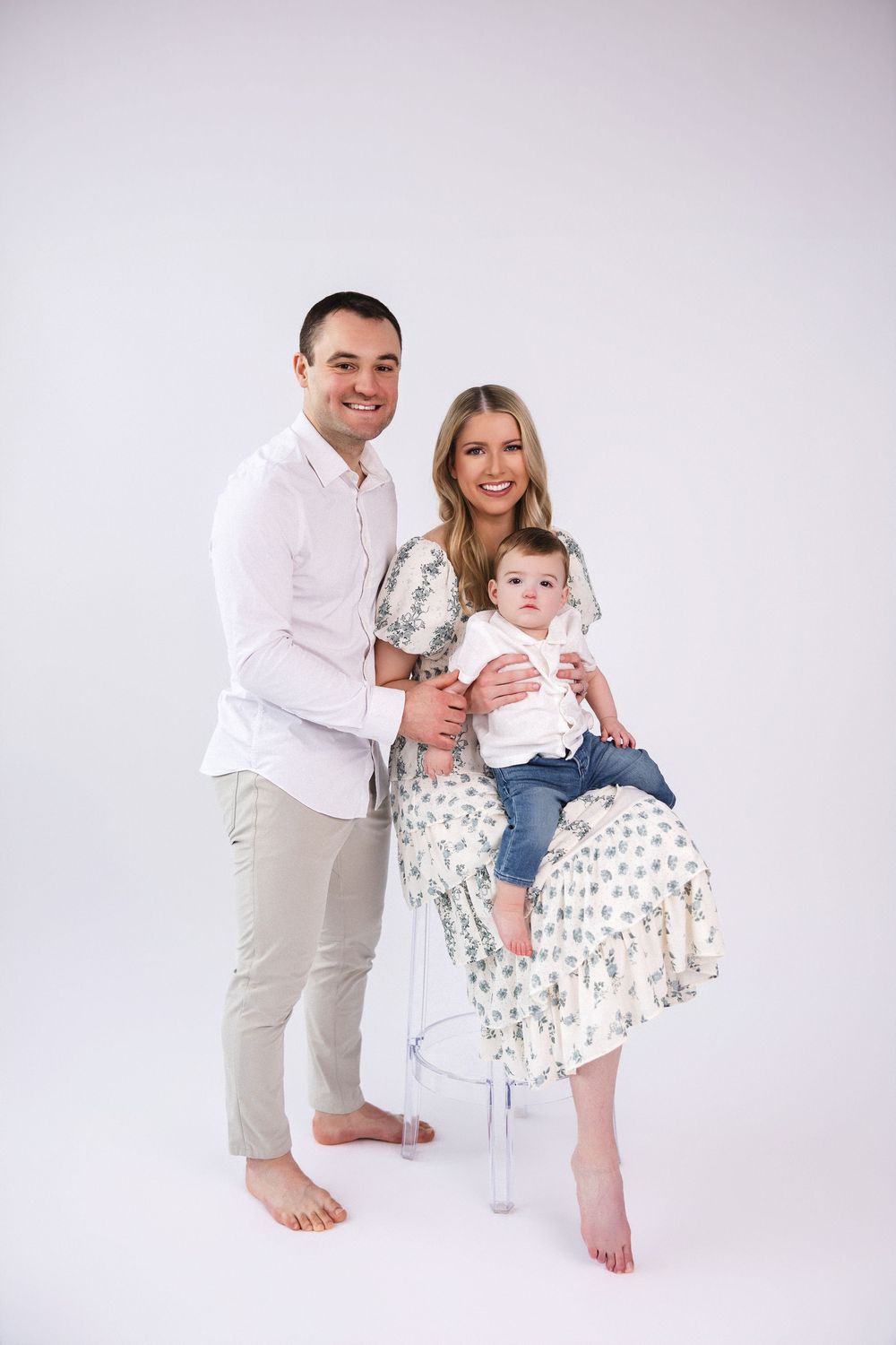 Studio family portrait against white background.